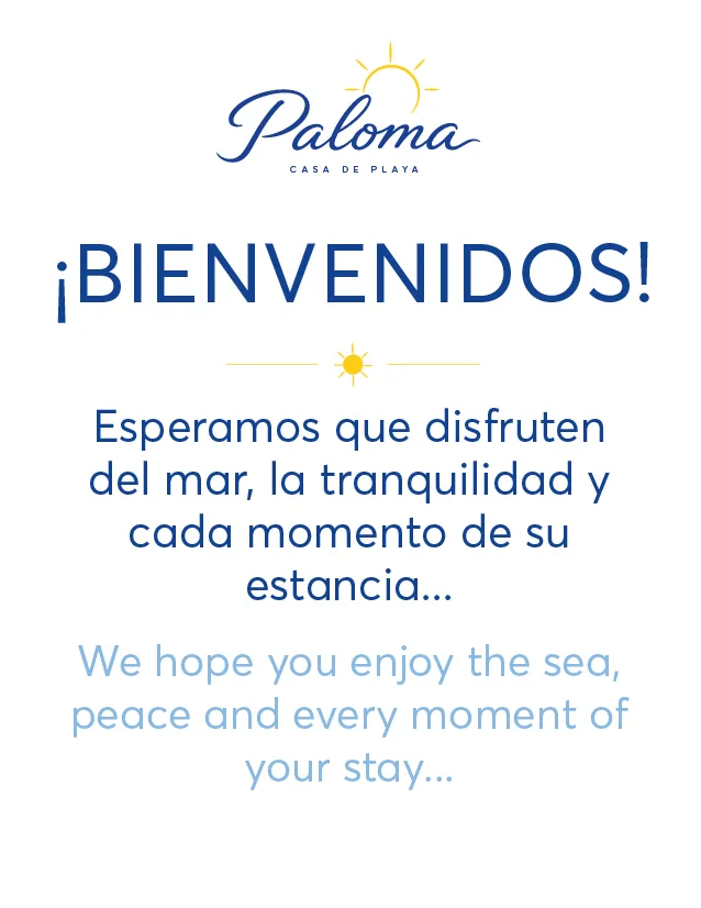 Señalética de bienvenida bilingüe de Paloma Casa de Playa.